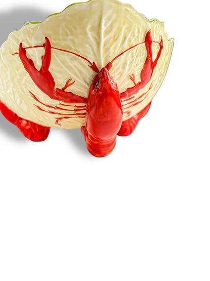 Ceramic bowl shaped and painted like a red lobster with detailed claws and shell pattern