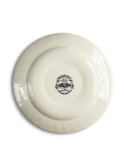 Reverse of the Churchill Herring’s Hunt Full Cry plate, showing the glazed cream back, foot ring, and kiln specks, with the circular black backstamp in the centre.