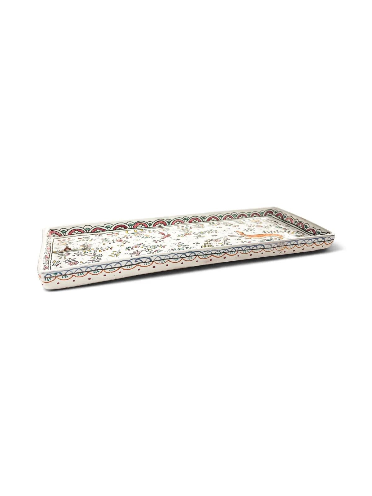 Angled view of Conimbriga Portugal rectangular faience tray showing scalloped rim and hand-painted animal scene