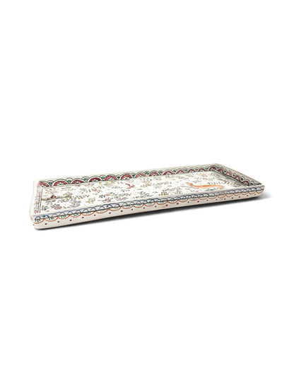 Angled view of Conimbriga Portugal rectangular faience tray showing scalloped rim and hand-painted animal scene