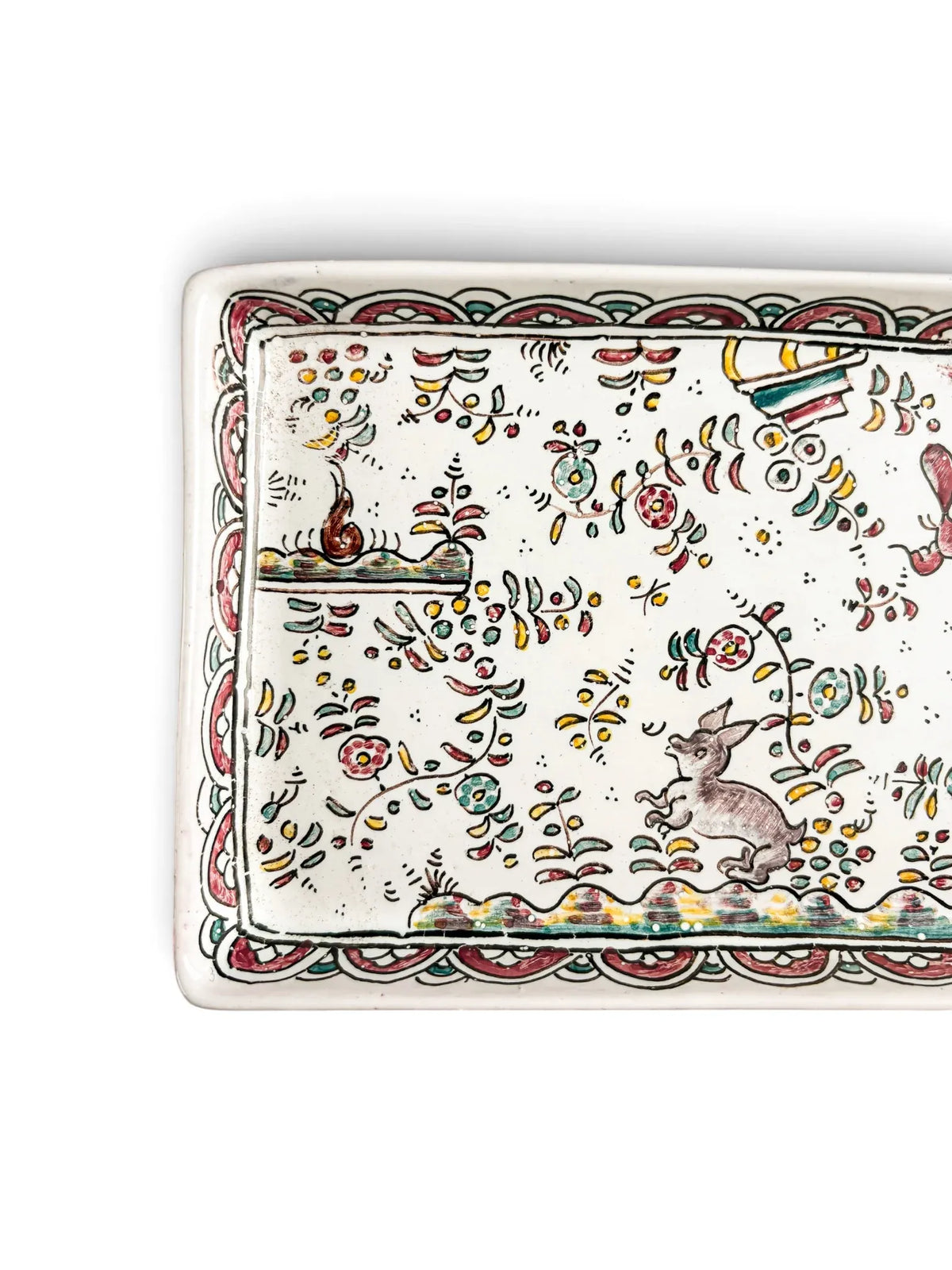 Close-up of grey hare and scalloped polychrome border on vintage Conimbriga Portuguese faience tray