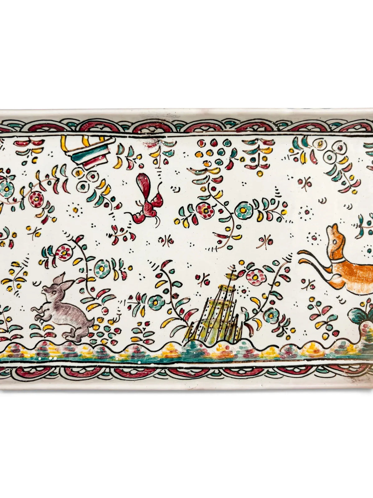 Detail of hand-painted hare, small building and flowers on Conimbriga SEC.XVII faience tray