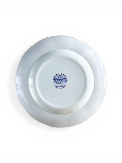 Reverse side of a Crown Ducal Bridge Scenes plate showing the blue backstamp. Text reads "Bridge Scenes, Decoration Hand Engraved, Dishwasher Proof, Crown Ducal, Made in England."