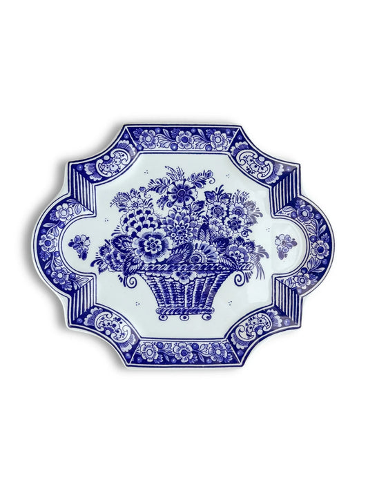 Blue and white ceramic plate with floral and basket pattern, ornate decorative border