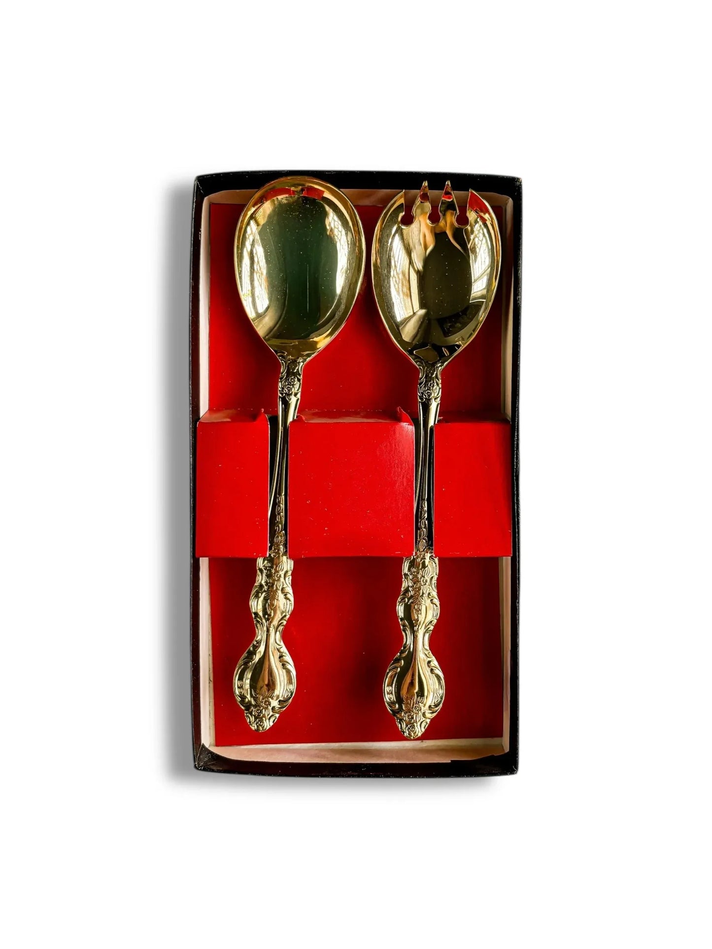 Set of ornate gold salad serving spoon and fork in a red and black gift box