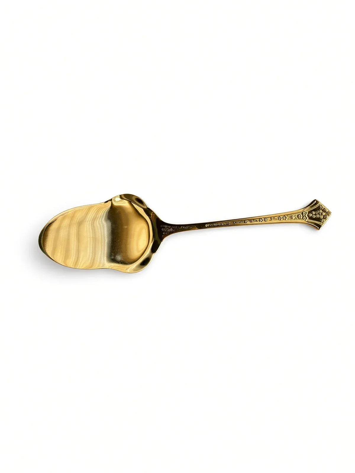 Overhead view of the Eetrite Fleur serving spoon on a white background, showing the front of the bowl and handle