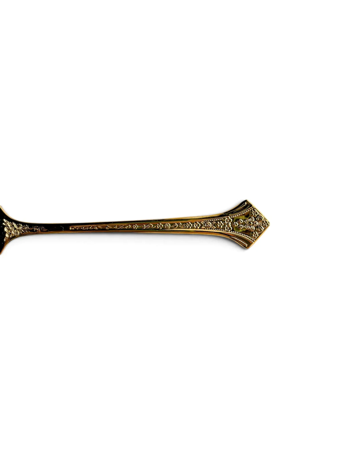 Close-up of the Fleur handle with embossed floral trellis and diamond-shaped floral terminal