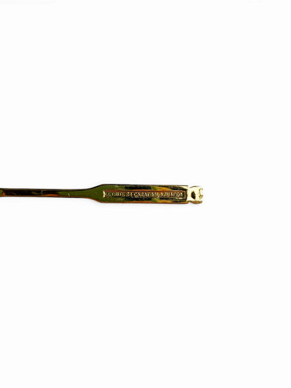 Close-up of the reverse side of an Eetrite teaspoon handle, showing the authentic hallmark stamp that reads "Eetrite 24 Carat Gold Plated.
