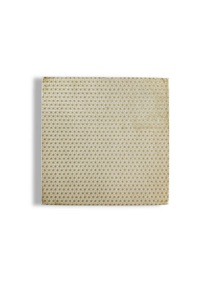 Square wrapped gift box with gold geometric floral pattern on white background