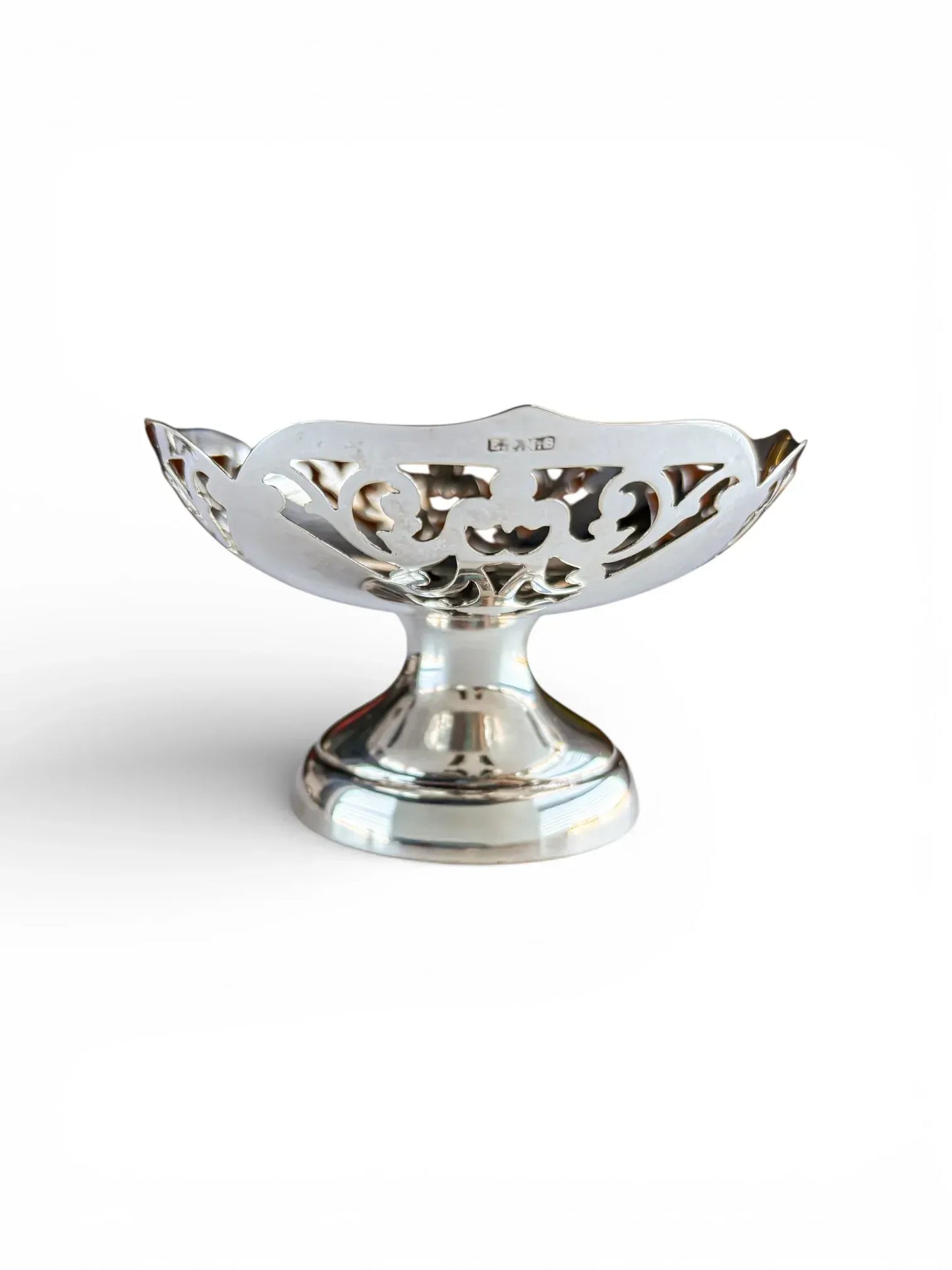 Side profile of a silver-plated pedestal dish featuring the EPNS hallmark on the scalloped rim.