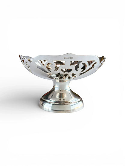 Side profile of a silver-plated pedestal dish featuring the EPNS hallmark on the scalloped rim.