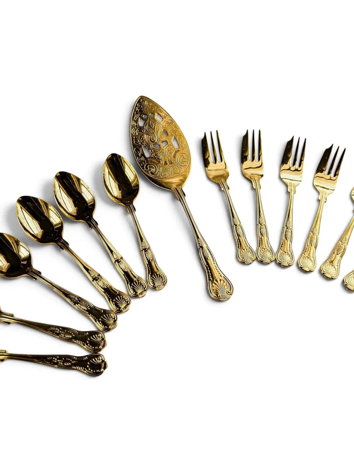 Vintage 24-carat gold-plated pastry set with pierced cake server, six teaspoons and six pastry forks arranged on a white background