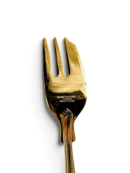 Reverse stamp reading Stainless Steel 24 Carat Gold Plated on a vintage pastry fork