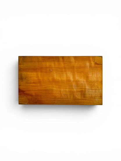 Underside view of the solid wood box, displaying the rich, natural grain pattern and authentic surface patina developed through decades of careful use.