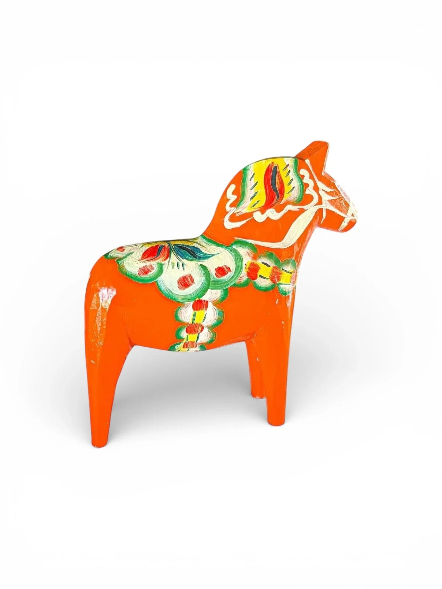 Vintage orange painted wooden horse figurine with Scandinavian folk art patterns