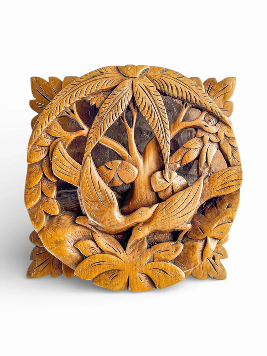 Hand-carved wooden trivet with tropical birds and leaf motif, vintage home decor