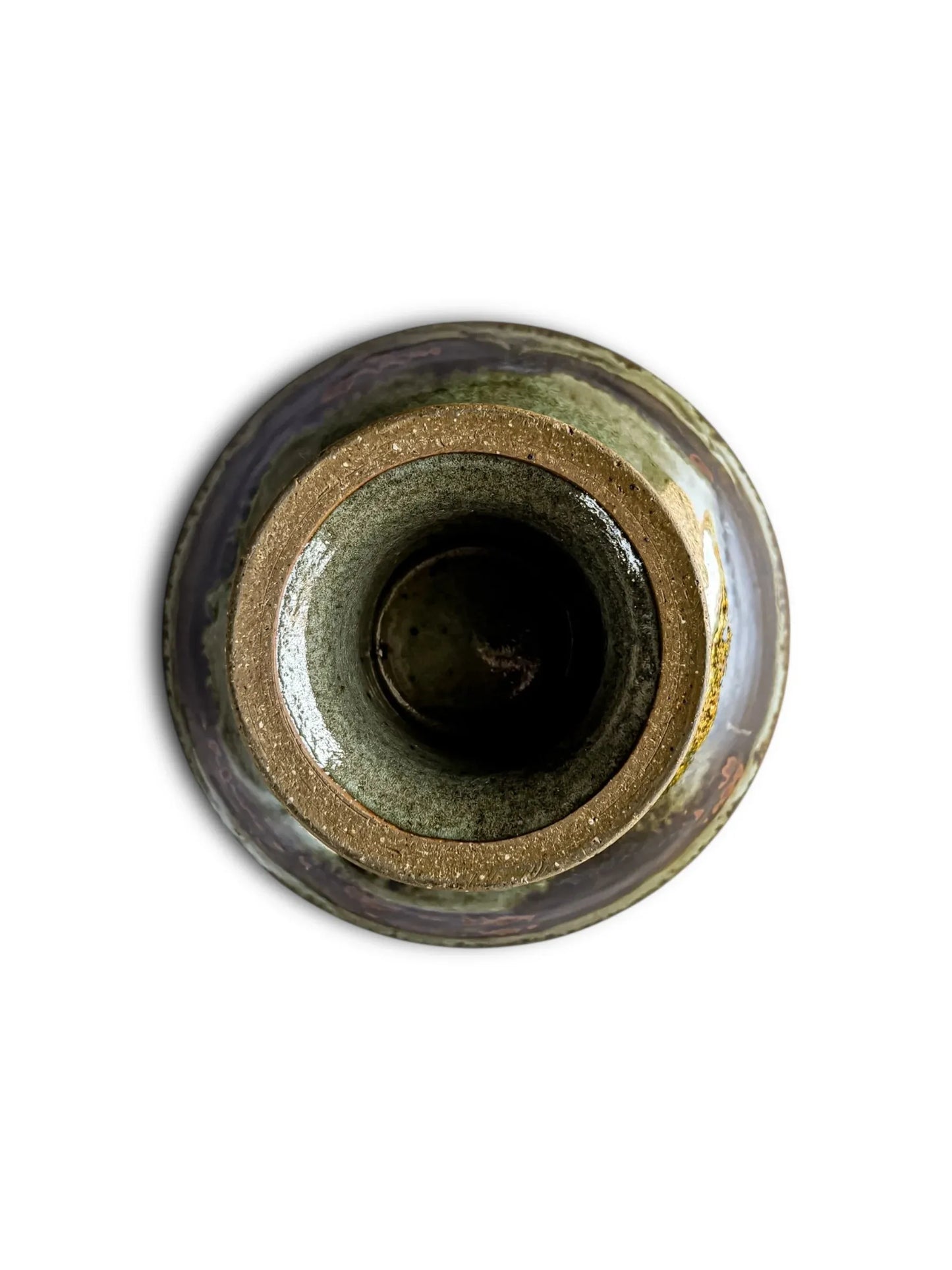 Top view of a rustic ceramic pottery vase with earthy brown and green glaze