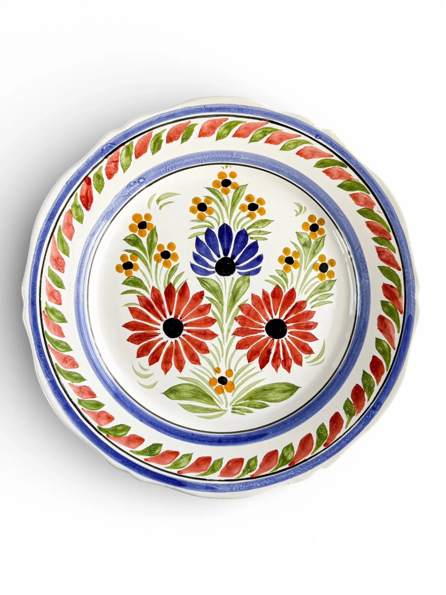 Hand-painted vintage ceramic plate with floral design, red and blue flowers, decorative tableware