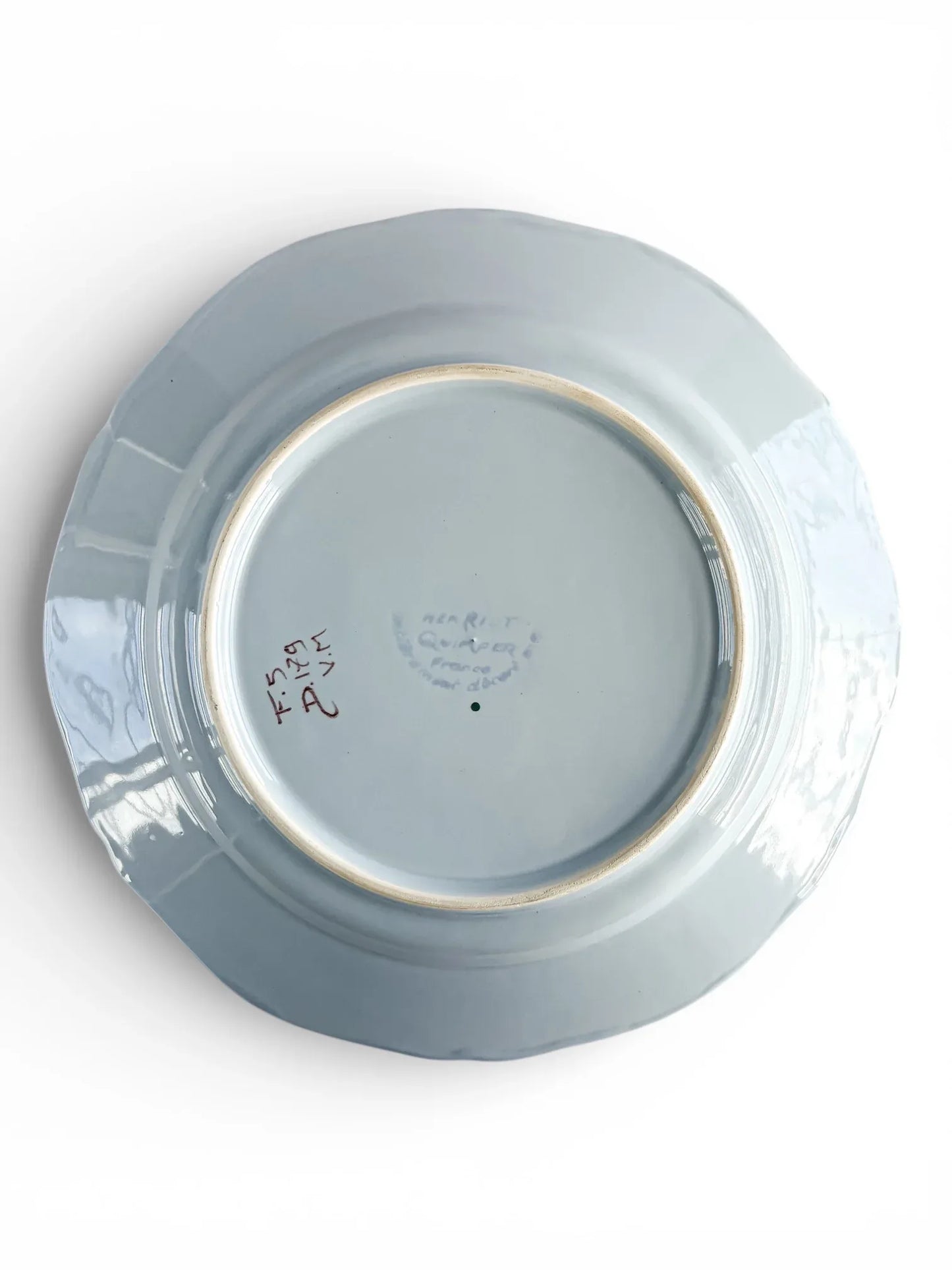 Vintage porcelain plate bottom with markings, collectible tableware on white background