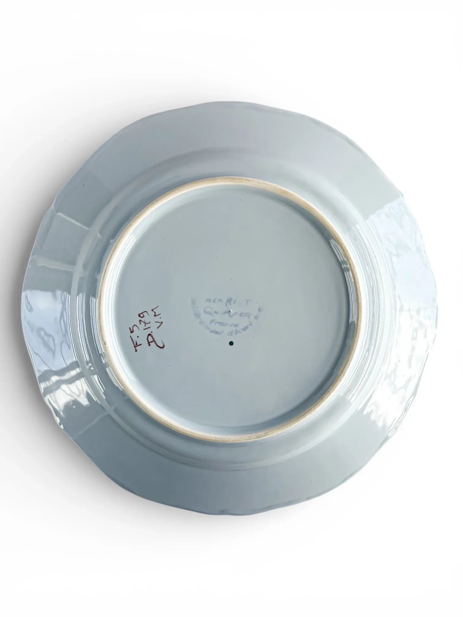 Vintage porcelain plate bottom with markings, collectible tableware on white background