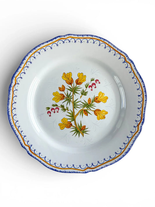 Vintage porcelain plate with blue and gold rim, floral center, and scalloped edge