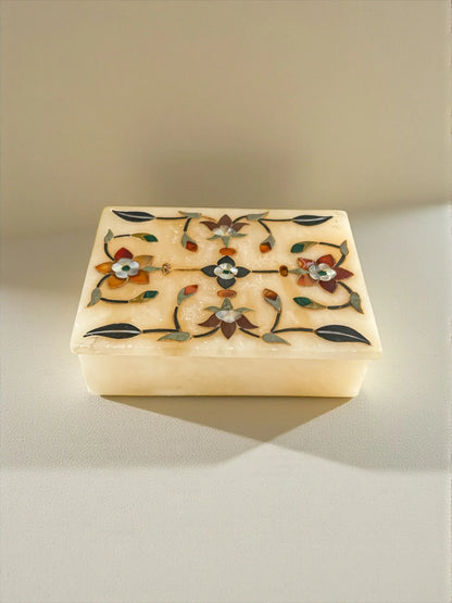 Ornate rectangular alabaster jewelry box with colorful floral inlay design on lid