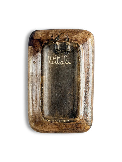 Rectangular vintage brown ceramic plaque with glossy finish and 'Vitala' written in cursive on back