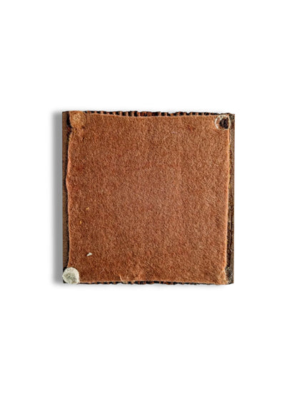 Square piece of brown felt fabric with rounded stitching corners on white background