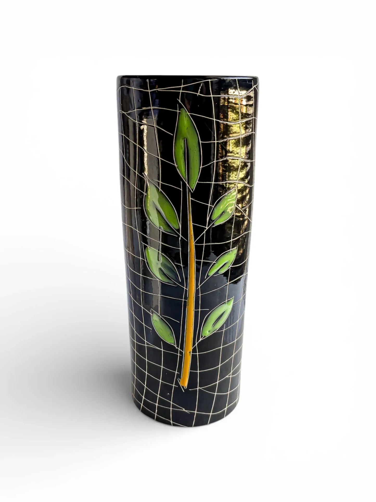Black ceramic vase with green leaf design and grid pattern, modern porcelain decor
