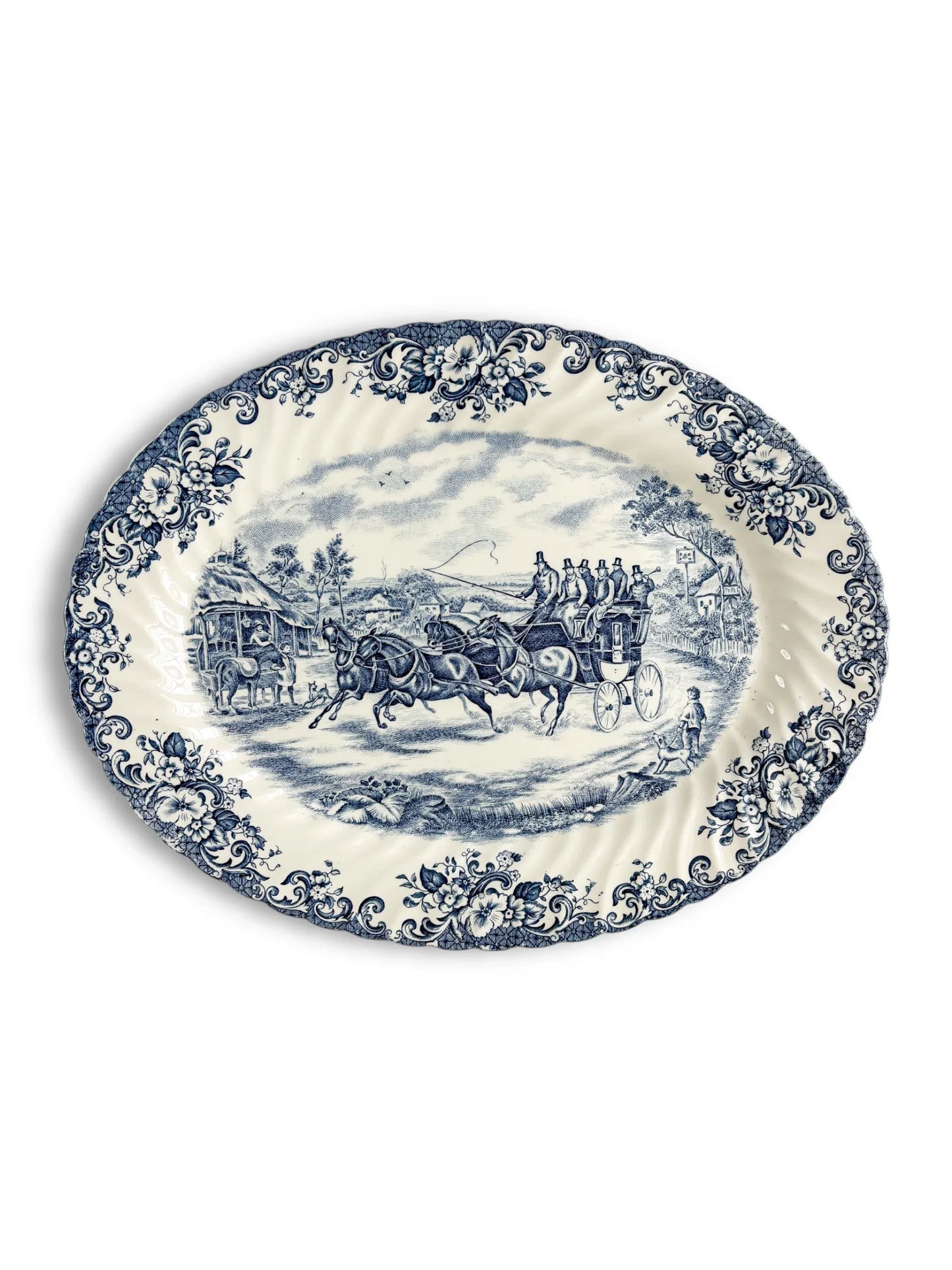 Vintage blue and white porcelain platter with floral border and stagecoach scene, collectible tableware