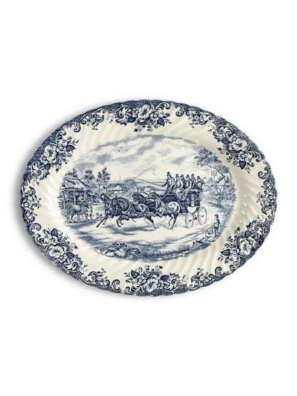 Vintage blue and white porcelain platter with floral border and stagecoach scene, collectible tableware