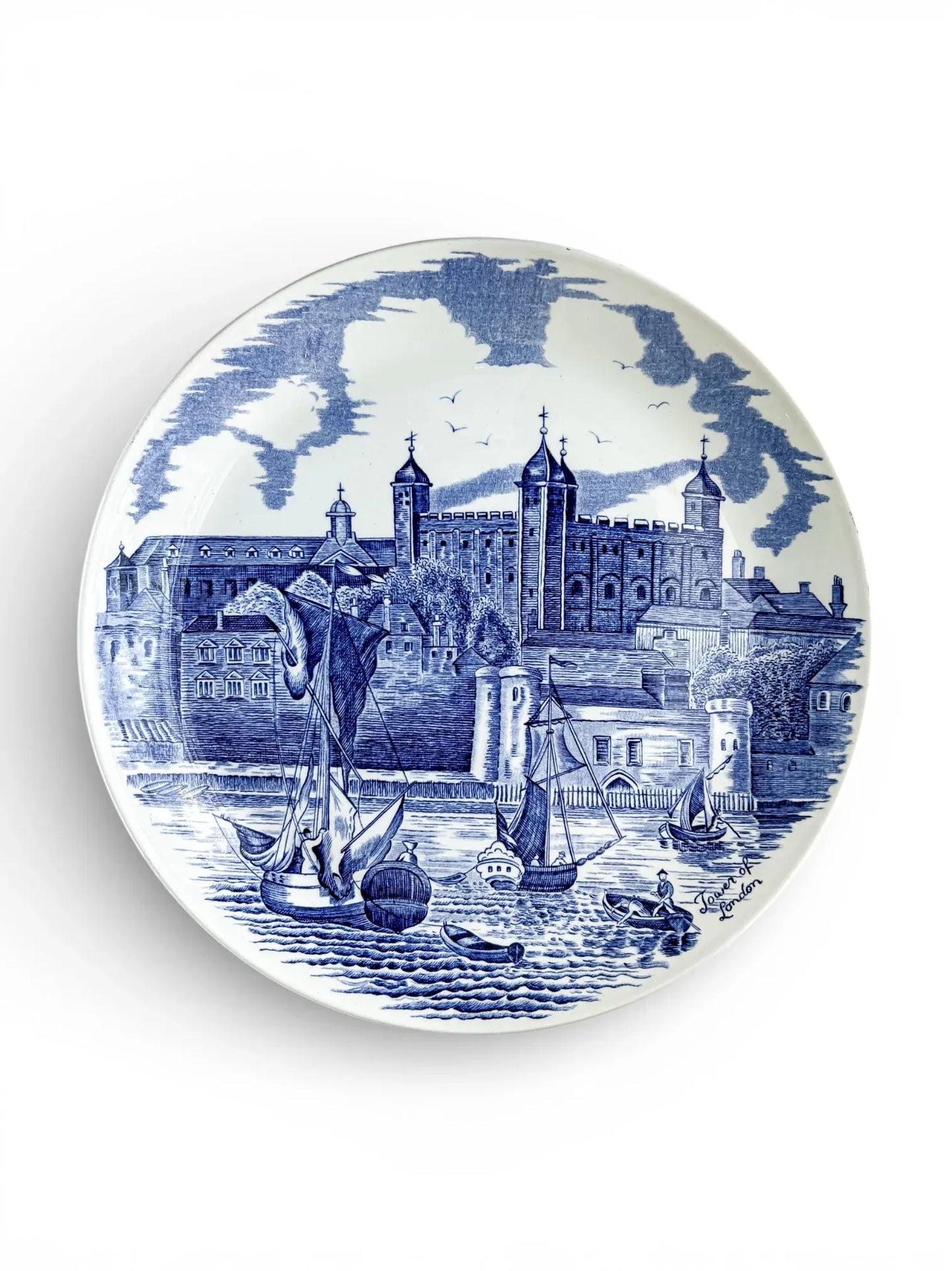 Vintage Johnson Bros blue and white dinner plate featuring a hand-engraved scene of the Tower of London and sailing ships on the Thames.