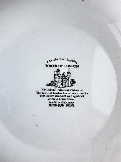 Close-up of the historical text on the back of a vintage Johnson Bros plate describing the nine-century history of the Tower of London.