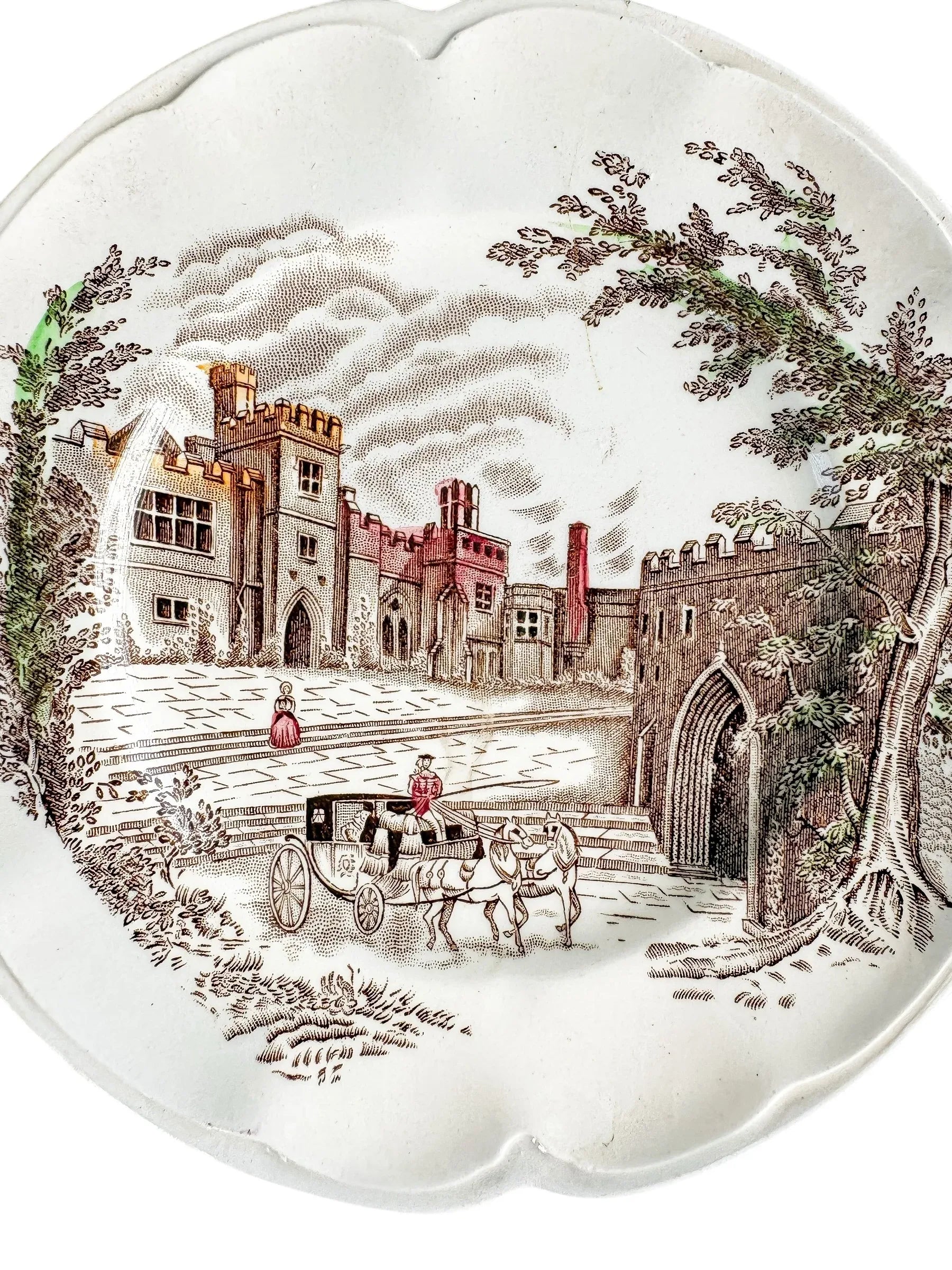Vintage plate with English castle, horse-drawn carriage, and trees illustration