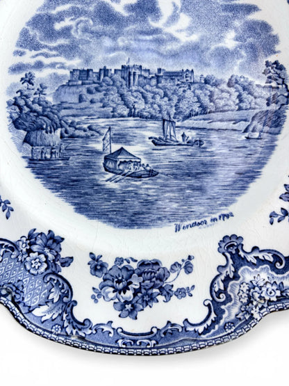 Close-up detail of the Windsor Castle 1792 engraving on a blue transferware plate, showing riverboats and intricate sky detailing.