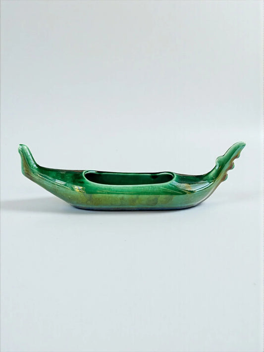 Green ceramic gondola-shaped decorative bowl with glossy finish on white background