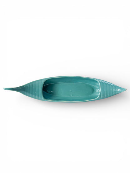 Vintage teal ceramic gondola-shaped dish on white background, collectible decor