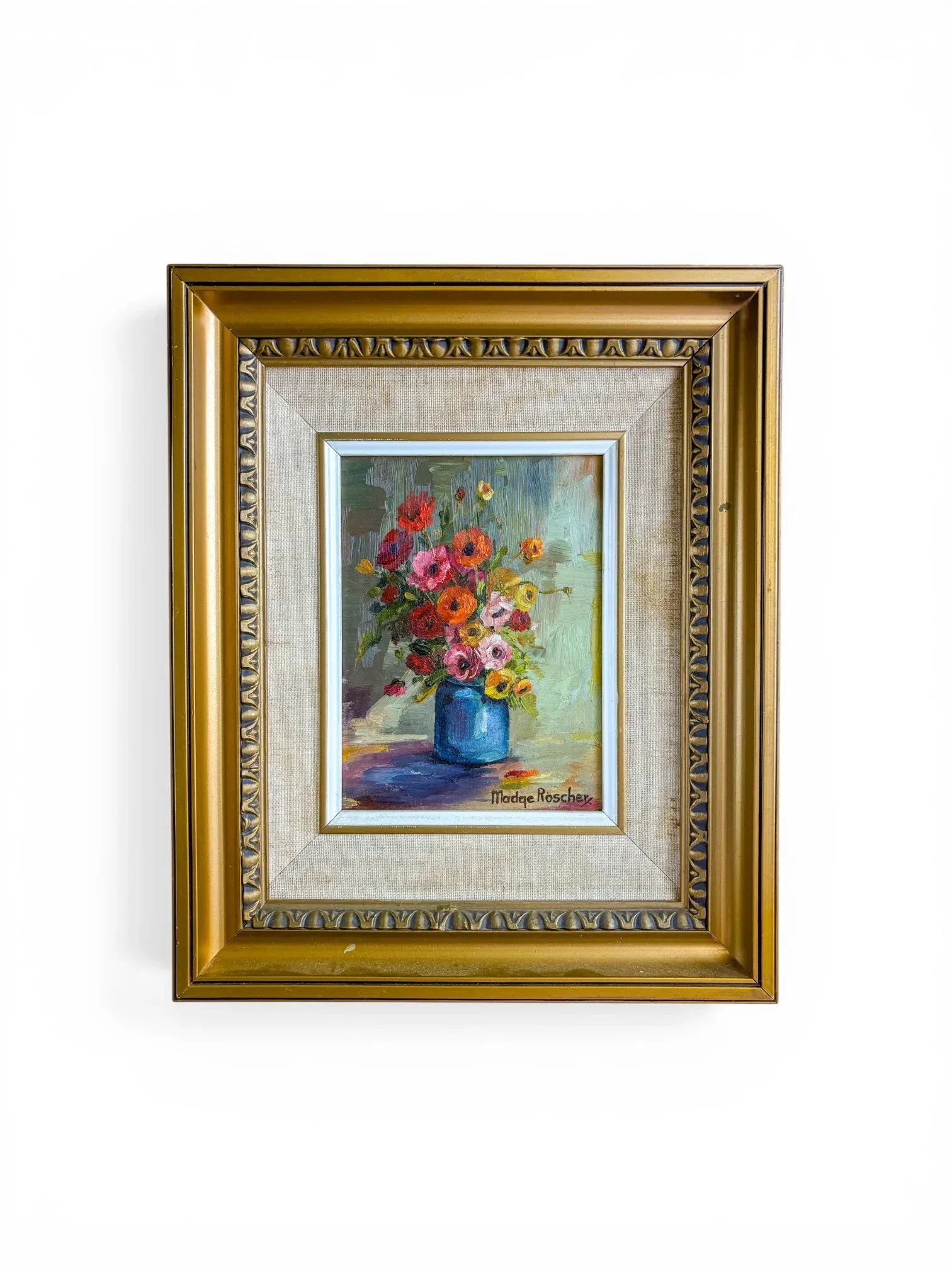 Original floral oil painting by South African artist Madge Röscher in an ornate vintage gold frame with a linen liner, isolated on a clean white background.