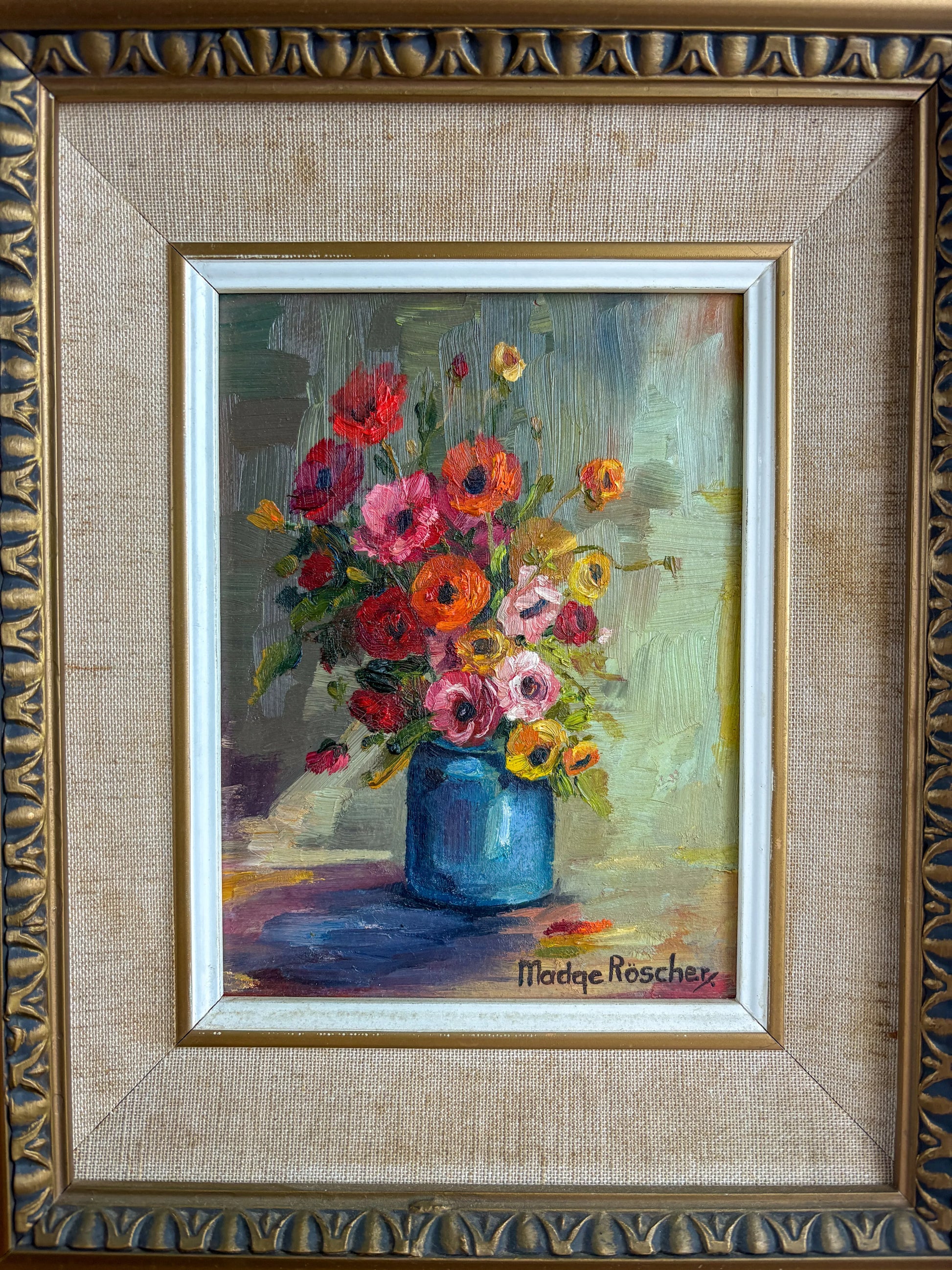 Close-up of a Madge Röscher floral still life showing the vintage linen matting, white inner fillet, and the textured gold detailing of the deep-cove frame.