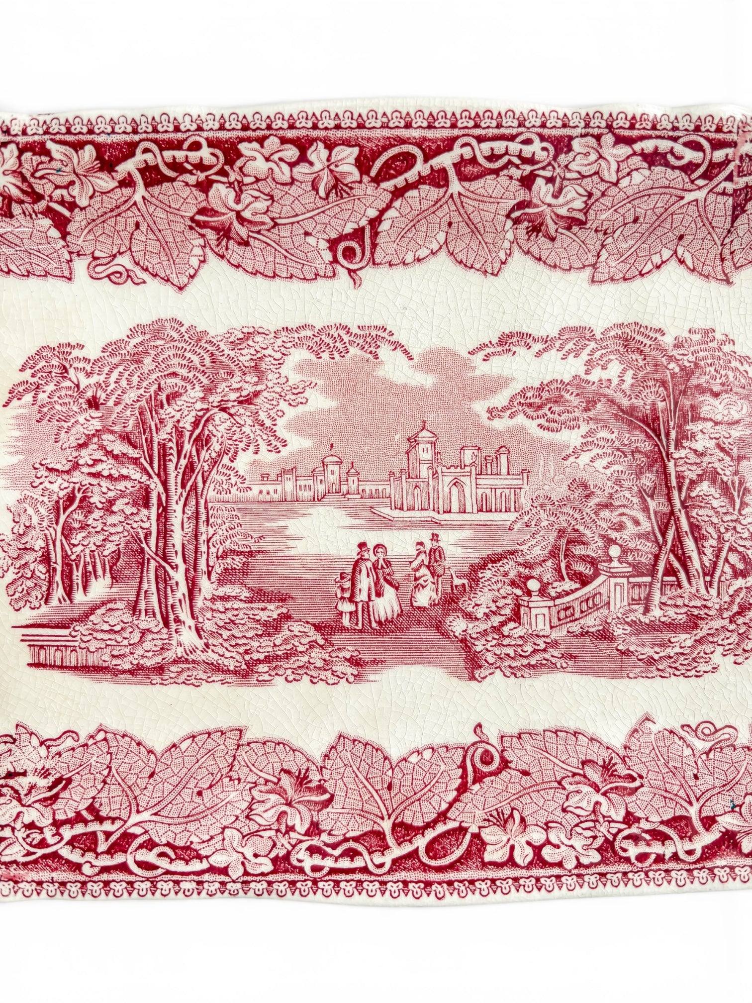 Close-up of the Mason’s Vista tray showing the detailed claret-red landscape transfer, floral border, glaze crazing and age-related staining.