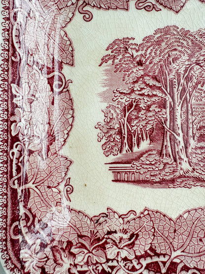 Close-up of the Mason’s Vista transferware surface showing fine glaze crazing, light staining and wear beside the scenic decoration.