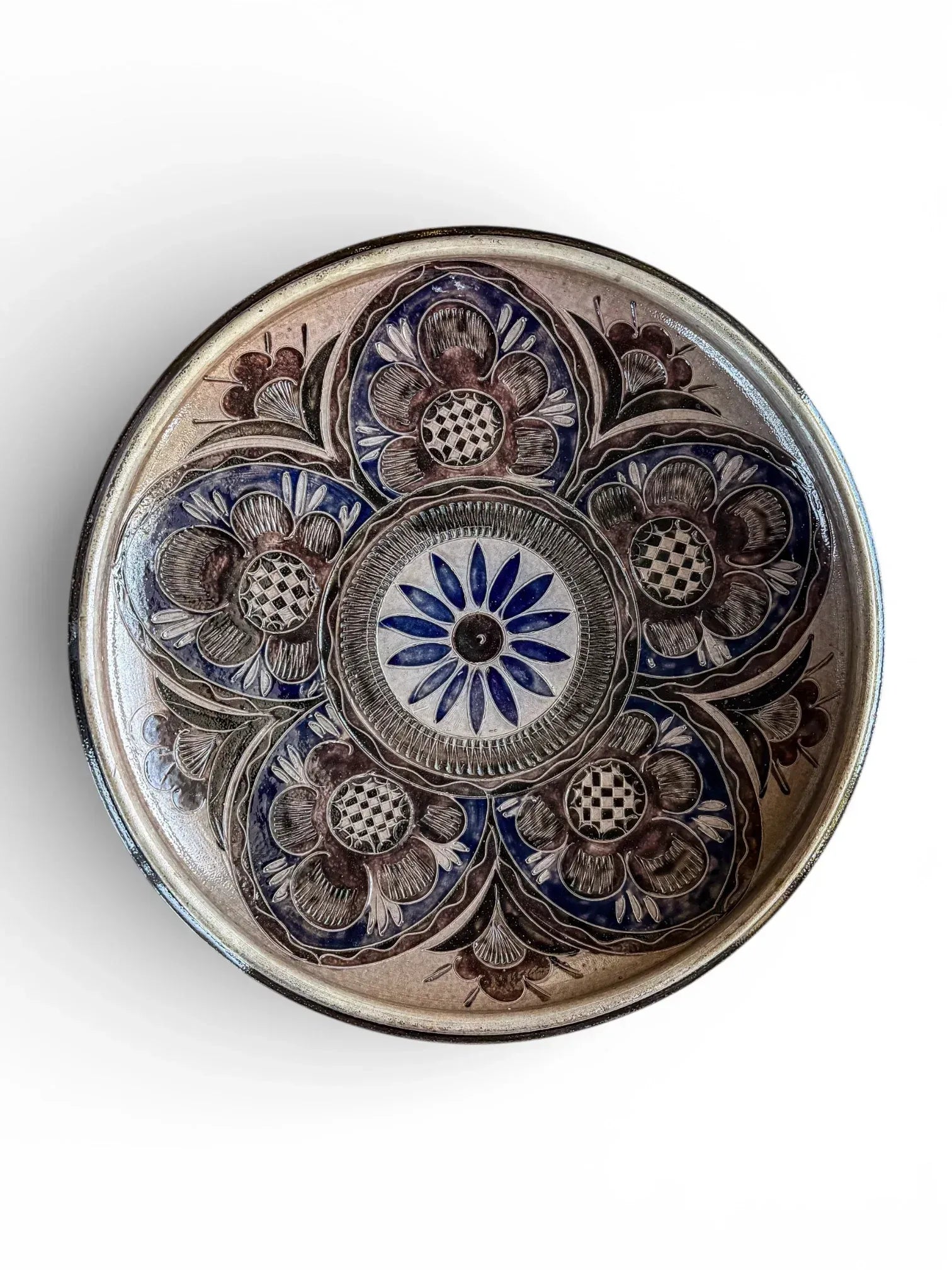 37cm Geschwister Bahn sgraffito floral charger in blue and manganese salt-glazed stoneware.