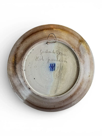 Reverse of salt-glazed charger showing pristine condition and original heavy copper hanging wire.