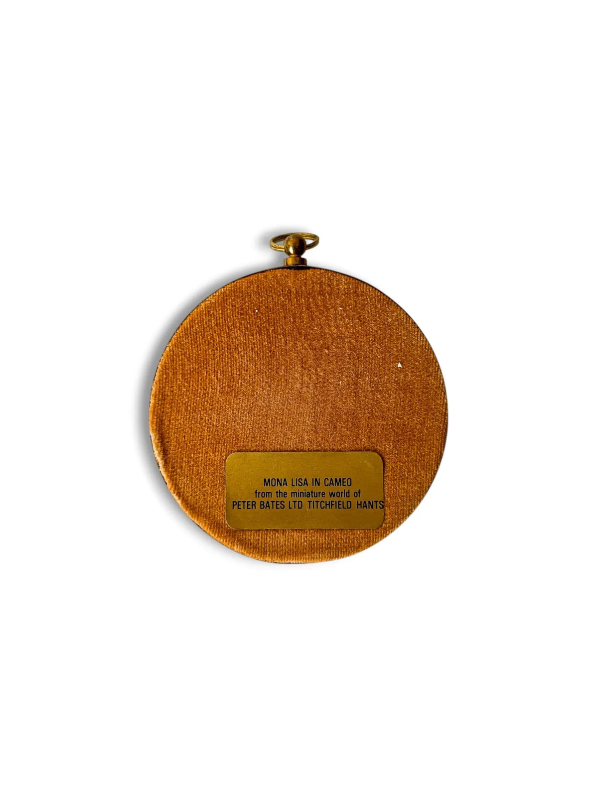 The camel velvet reverse of a Peter Bates Mona Lisa cameo, with the original foil label reading Mona Lisa in Cameo, from the miniature world of Peter Bates Ltd, Titchfield, Hants.