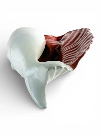 Porcelain whale-shaped dish with white body and brown tail, vintage serveware collectible.