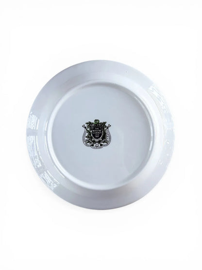 The reverse of a Portmeirion Botanic Garden plate showing the official shield-shaped backstamp, including "Dishwasher Proof," "Oven to Table," and "Made in England" branding.