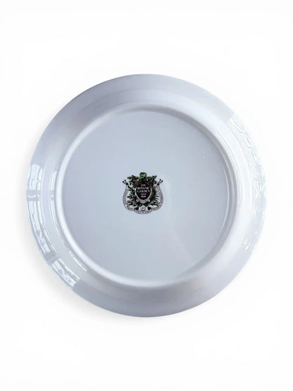 Reverse view of the Portmeirion salad plate showing the authentic green shield backstamp and care instructions.