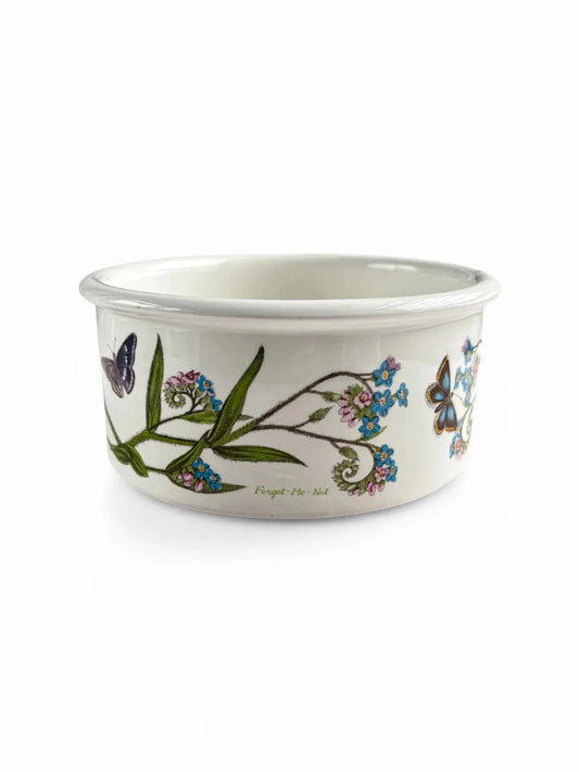 Ceramic bowl with floral and butterfly design on a white background
