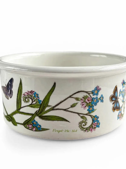 Ceramic bowl with floral and butterfly design on a white background