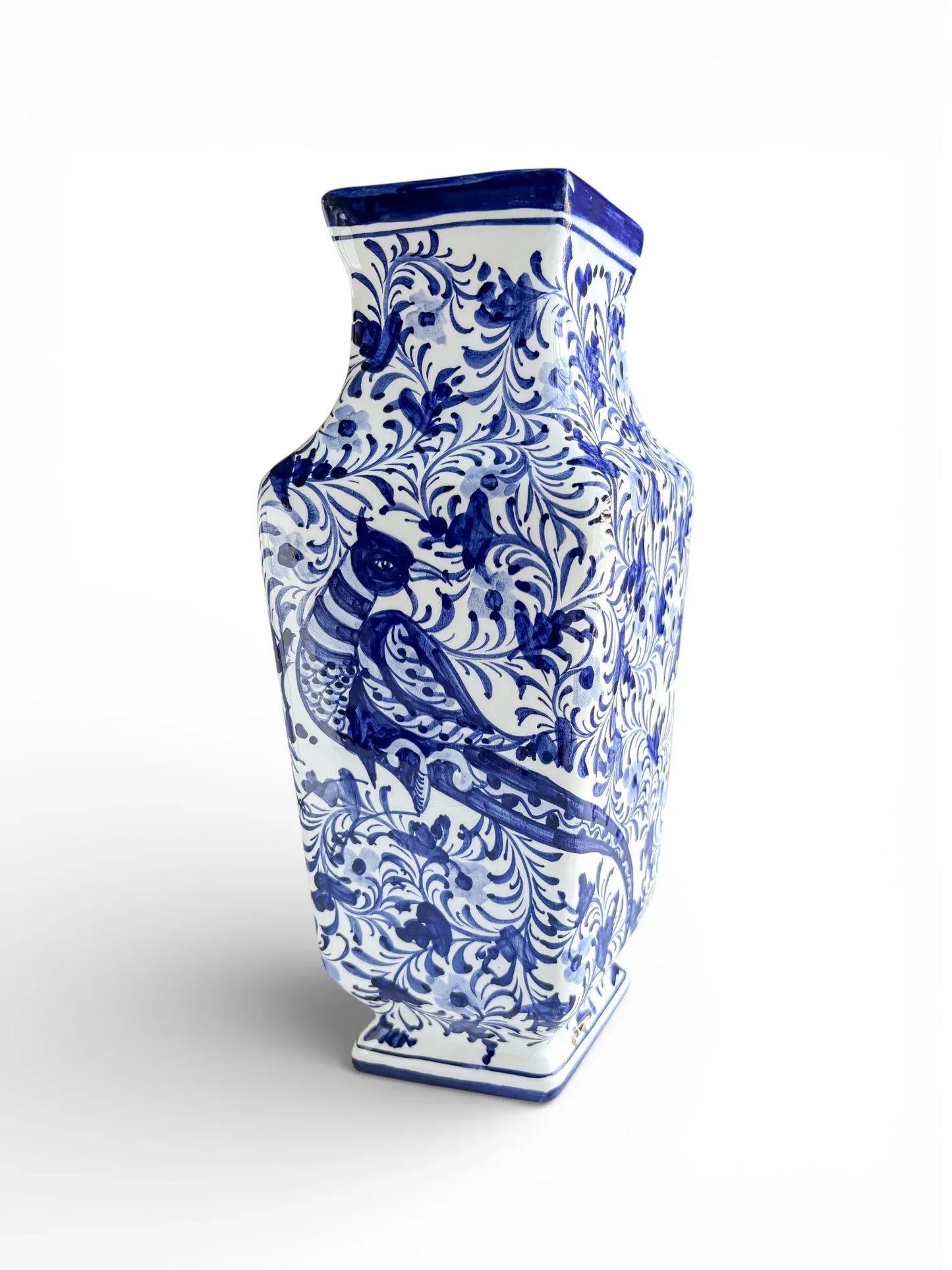 Blue and white porcelain vase with intricate floral and bird patterns, vintage home decor